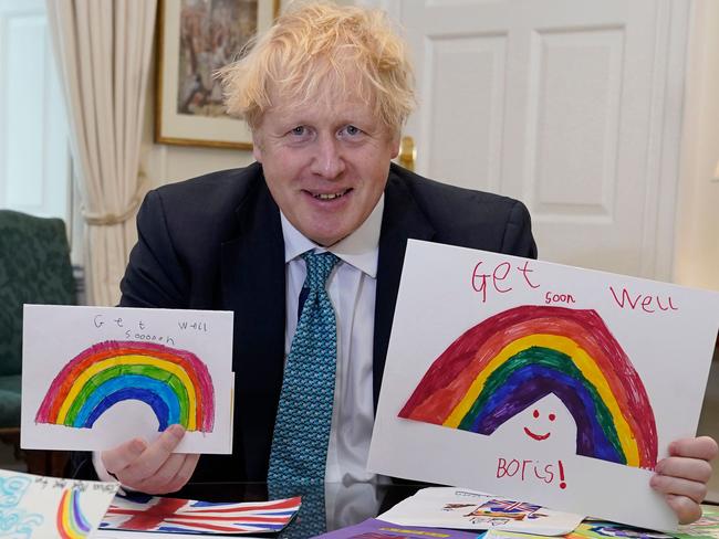 New dad Boris Johnson displaying his Get Well Soon cards sent in by children while he was ill with the novel coronavirus. Picture: AFP