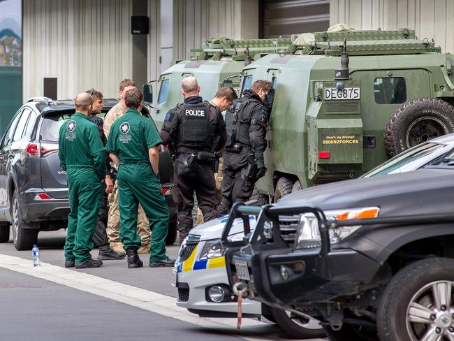 Police are seen at the Christchurch District Court precinct for the arrival of the alleged gunmanon charges of murder.