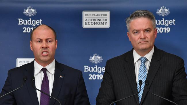 Treasurer Josh Frydenberg and Minister for Finance Mathias Cormann speak to journalists during the 2019 Budget Lockup at Parliament House in Canberra. Picture: AAP/Mick Tsikas