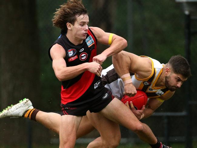 Aaron D'Angelo is bumped by Jason McCormick. Picture: Hamish Blair