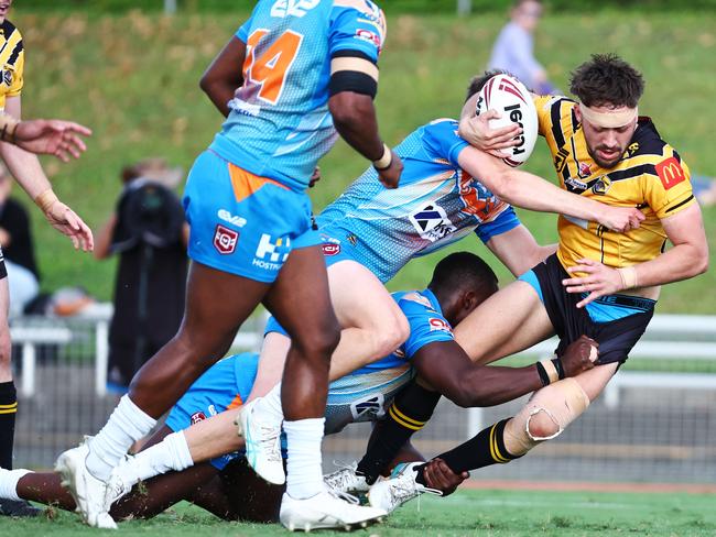 Sunshine Coast's Ammaron Gudgeon is put to ground in the Hostplus Cup Queensland Rugby League (QRL) match between the Northern Pride and the Sunshine Coast Falcons, held at Barlow Park, Cairns Picture: Brendan Radke