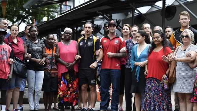 Members of the public, police force and football club members link arms to fight against domestic violence. PICTURE: Ivan Rachman