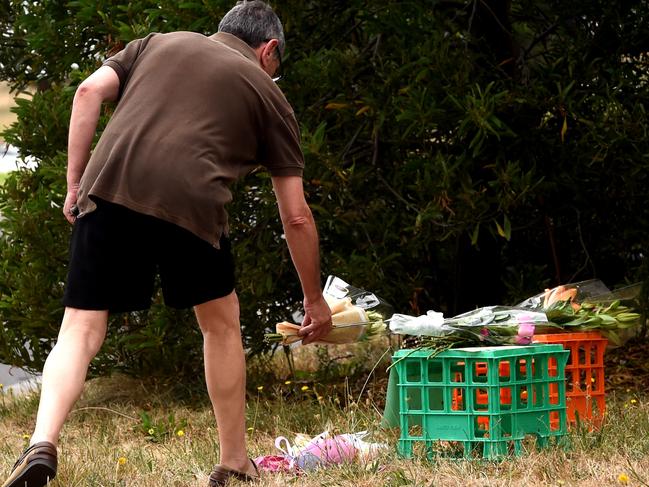 Con Ippolito leaves flowers for the young victim. Picture: Nicole Garmston