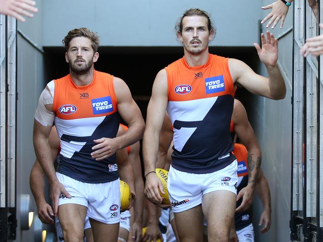 Collingwood v Greater Western Sydney at the MCG. Phil Davis and Callan Ward lead the giants onto the MCG  . Pic: Michael Klein