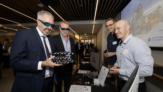 Assistant Minister for Education Anthony Chisholm is holding a structure of graphite key for lithium-ion batteries with director of the Resources Technology and Critical Minerals Trailblazer, Rohan McDougall, and RapidGraphite founders, Dr Jason Fogg and Dr Jacob Martinduring. Picture: Matt Jelonek