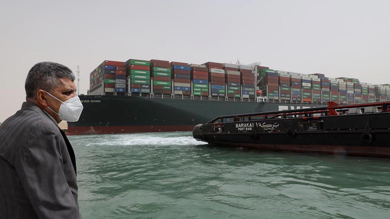 Egyptian officials checking the operation trying to free Taiwan-owned cargo MV Ever Given. Picture: AFP