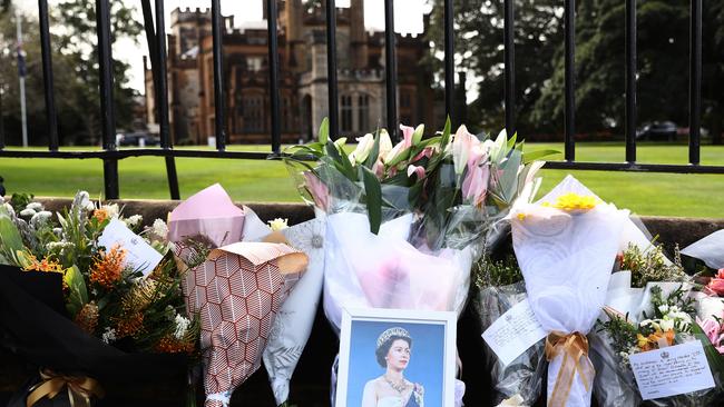 SYDNEY, AUSTRALIA - SEPTEMBER 09: Floral tributes for Queen Elizabeth II are seen at Government House on September 09, 2022 in Sydney, Australia. Queen Elizabeth II died at Balmoral Castle in Scotland aged 96 on September 8, 2022, and is survived by her four children, Charles, Prince of Wales, Anne, Princess Royal, Andrew, Duke Of York and Edward, Duke of Wessex. Elizabeth Alexandra Mary Windsor was born in Bruton Street, Mayfair, London on 21 April 1926. She married Prince Philip in 1947 and acceded the throne of the United Kingdom and Commonwealth on 6 February 1952 after the death of her Father, King George VI. Queen Elizabeth II was the United Kingdom's longest-serving monarch. (Photo by Mark Metcalfe/Getty Images)