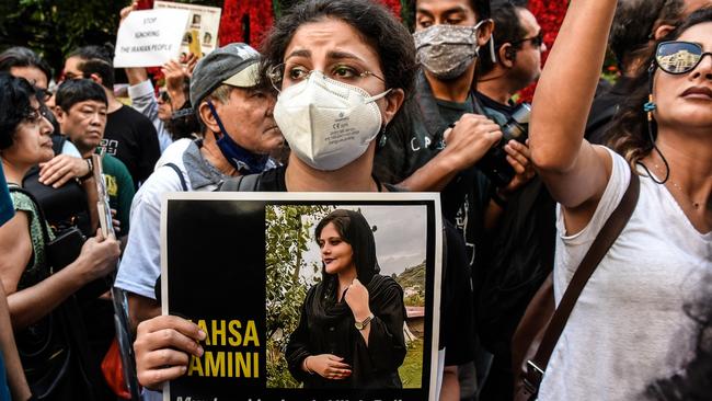 NEW YORK, NY - SEPTEMBER 21: People participate in a protest against Iranian President Ebrahim Raisi outside of the United Nations on September 21, 2022 in New York City. Protests have broke out over the death of 22-year-old Iranian woman Mahsa Amini, who died in police custody for allegedly violating the country's hijab rules. Amini's death has sparked protests across Iran and other countries. (Photo by Stephanie Keith/Getty Images)