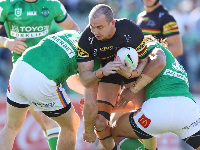 CANBERRA, AUSTRALIA - AUGUST 24: Dylan Edwards of the Panthers is tackled during the round 25 NRL match between Canberra Raiders and Penrith Panthers at GIO Stadium, on August 24, 2024, in Canberra, Australia. (Photo by Mark Nolan/Getty Images)