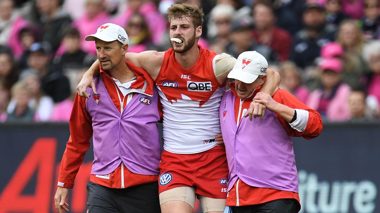 Alex Johnson of the Swans is seen after sustaining an injury against Melbourne. (AAP Image/Julian Smith)