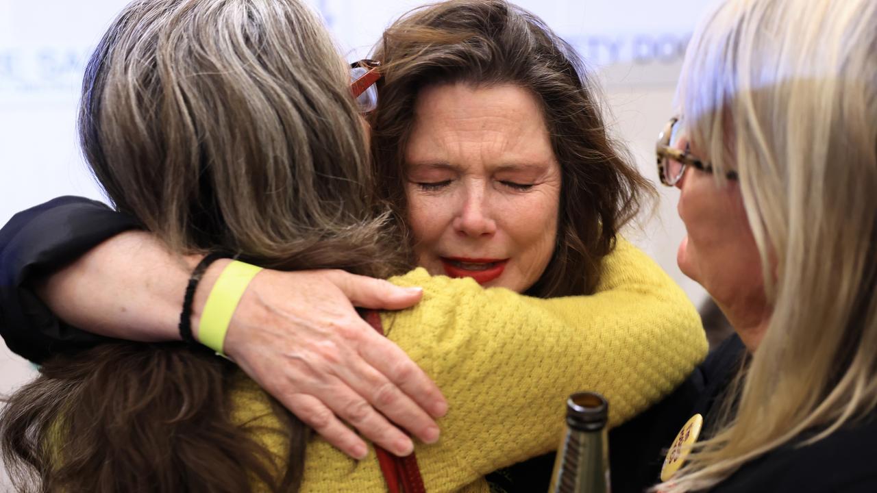 Devastated Yes voters console each other at an official event in Sydney. Picture: Jenny Evans/Getty Images