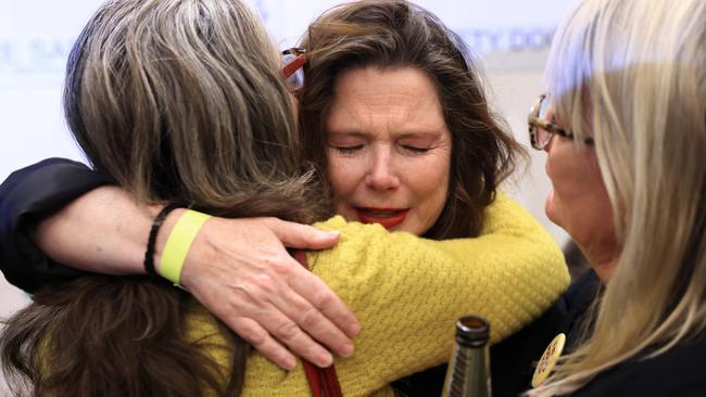 Devastated Yes voters console each other at an official event in Sydney. Picture: Jenny Evans/Getty Images