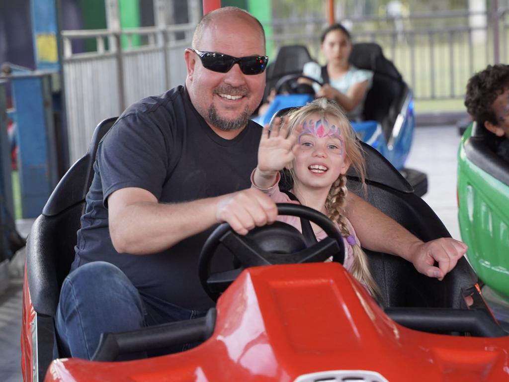 Trevor Jarrett with daughter Emily Jarrett, 6, both of Hay Point, enjoying the free dodgem cars at the 50th anniversary celebrations of the Coppabella township. Picture: Heidi Petith