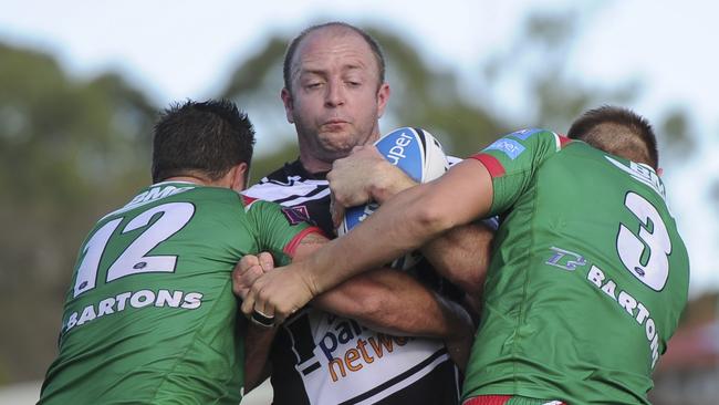 Tweed CEO Paul Stephenson (centre) during his playing days. Picture: SMP Images