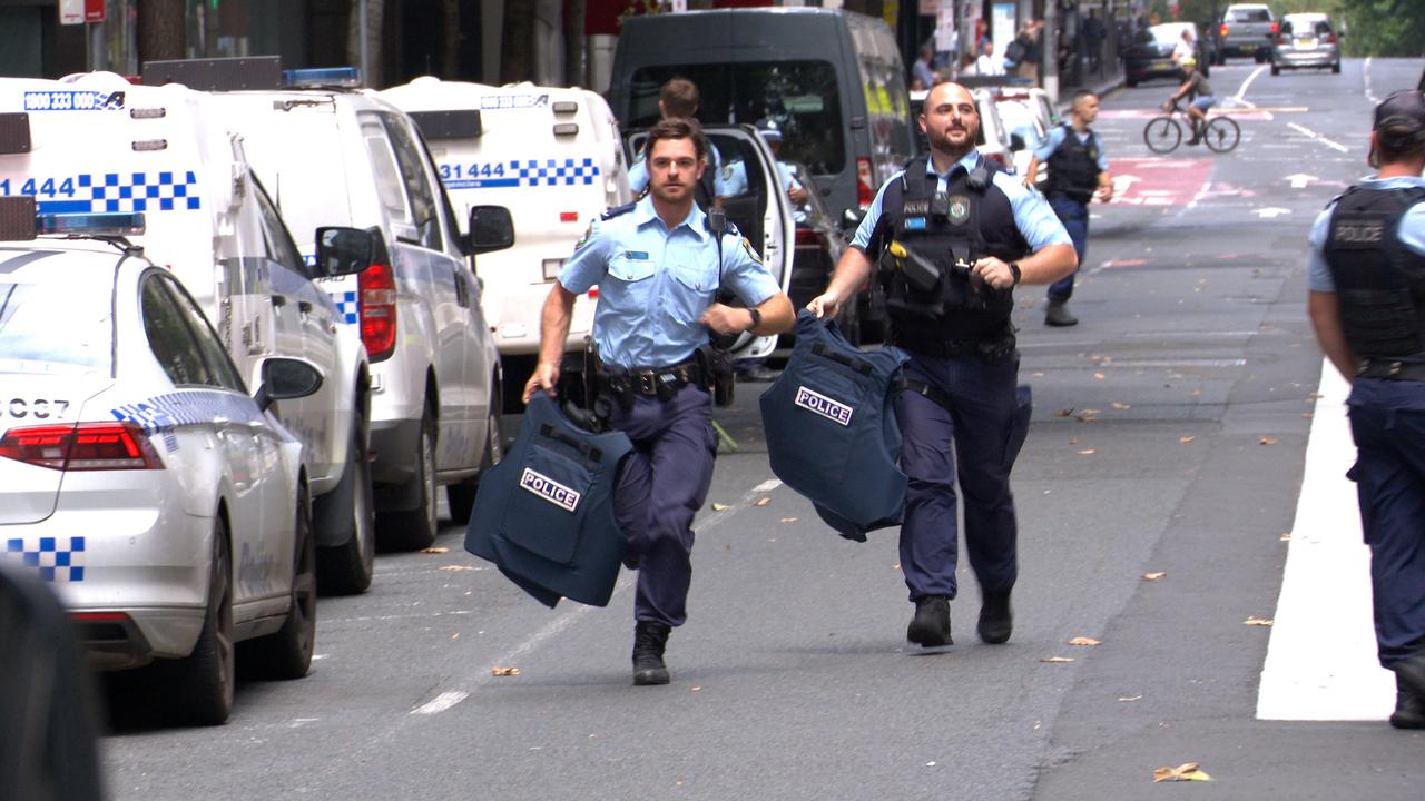 Police officers could be seen sprinting towards the crime scene pulling on bulletproof vests. Picture: OnScene Bondi