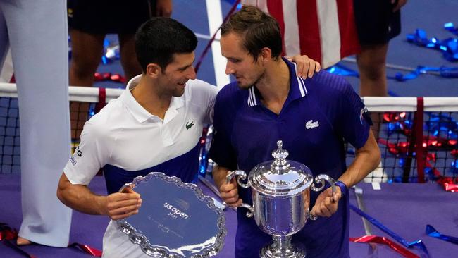 Djokovic and Medvedev hold their trophies. Picture: AFP