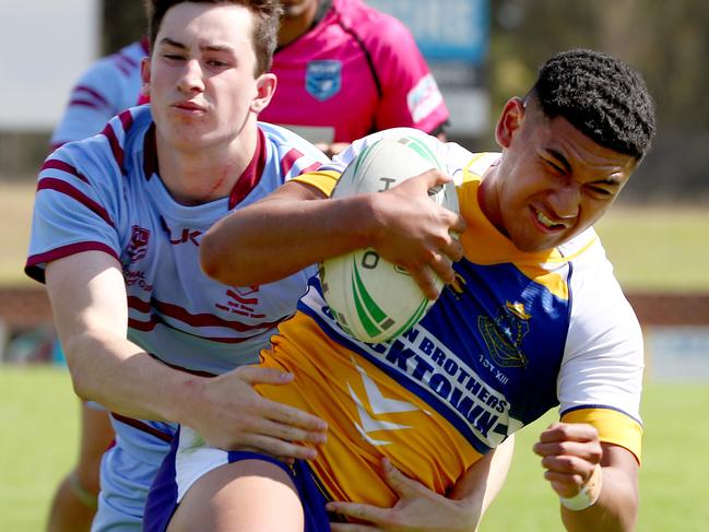 NRL Schoolboy Cup - Patrician Bros v St Gregs at South Windsor. Patrician Bros Isaiya Katoa breaks a tackle to score a try in the Patrician Bro's 52-22 win. Picture: Toby Zerna