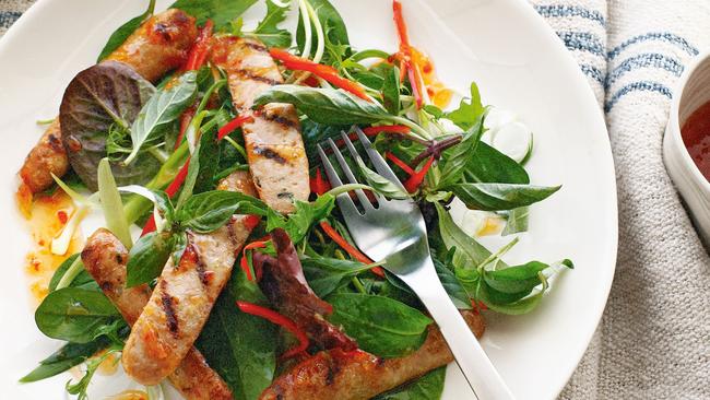 Chargrilled pork sausages with Thai-style salad. Picture: Supplied