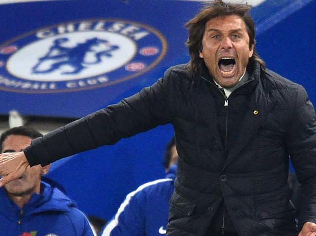 (FILES) In this file photo taken on November 05, 2017 Chelsea's Italian head coach Antonio Conte gestures on the touchline during the English Premier League football match between Chelsea and Manchester United at Stamford Bridge in London on November 5, 2017. The long-running saga over Antonio Conte's future appears to have been resolved with Chelsea sacking him as manager and appointing Maurizio Sarri, according to media reports on July 12, 2018. / AFP PHOTO / Glyn KIRK / RESTRICTED TO EDITORIAL USE. No use with unauthorized audio, video, data, fixture lists, club/league logos or 'live' services. Online in-match use limited to 75 images, no video emulation. No use in betting, games or single club/league/player publications.  /