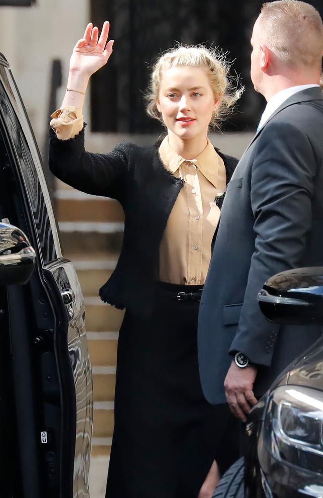 Amber Heard said her ex-husband Johnny Depp threw dozens of bottles at her ‘like grenades’, as she gave evidence for a third day at his London libel action. Picture: AFP