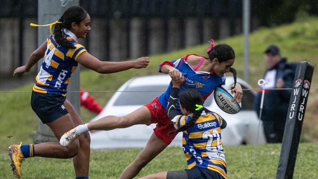 Manly’s Eden Melham dives over in the corner for a try in the U18s.