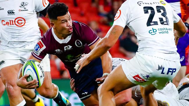 Hunter Paisami looks to offload against the Sharks. Picture: AFP