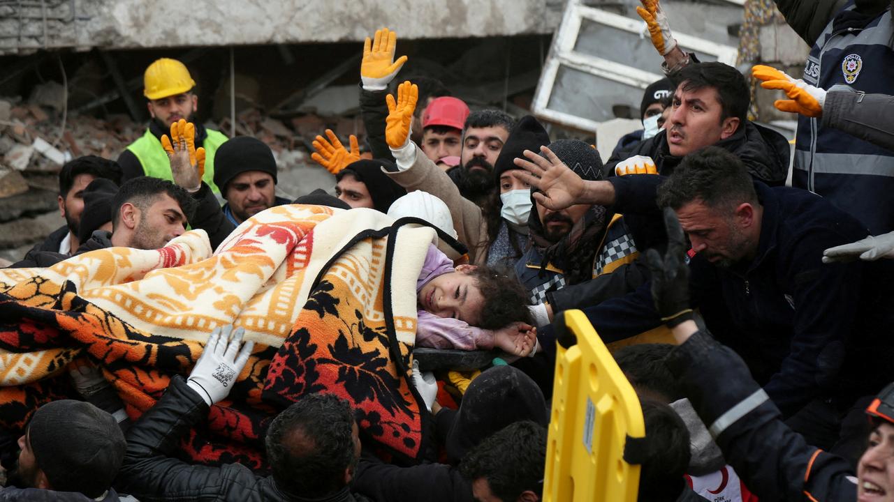 Rescuers carry out a girl from a collapsed building following an earthquake in Diyarbakir, Turkey February 6, 2023. REUTERS/Sertac Kayar TPX IMAGES OF THE DAY