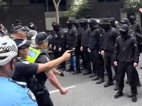 Police confront a group of suspected neo-Nazi at a pro-refugee rally. Picture: TikTok/permanentvisaforrefugees