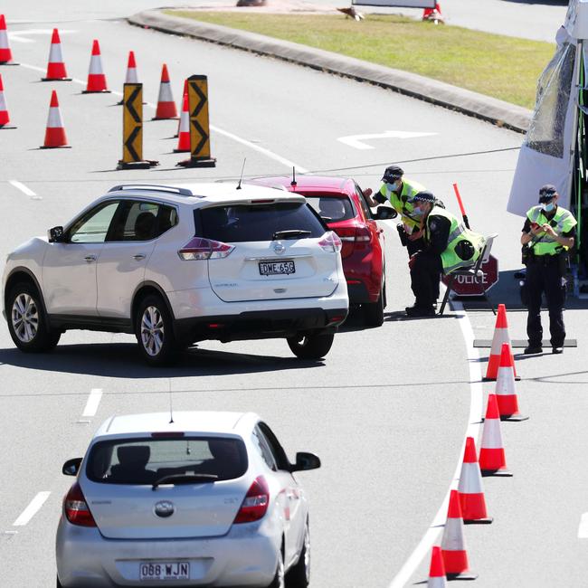 Police at the Queensland border on the Gold Coast Highway, Coolangatta. Picture: NIGEL HALLETT