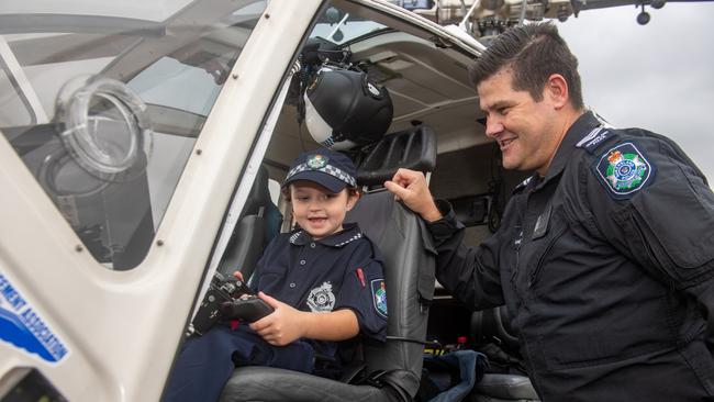 Savannah Burns in the police helicopter at the Gatton Showgrounds with sergeant Cameron Bourke, thanks to the Make A Wish Foundation and the Gatton Police station. PHOTO: Ali Kuchel