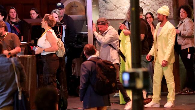 The La La Land actor was spotted running up to a moving tram in an all-yellow ensemble. Picture: Damian Shaw