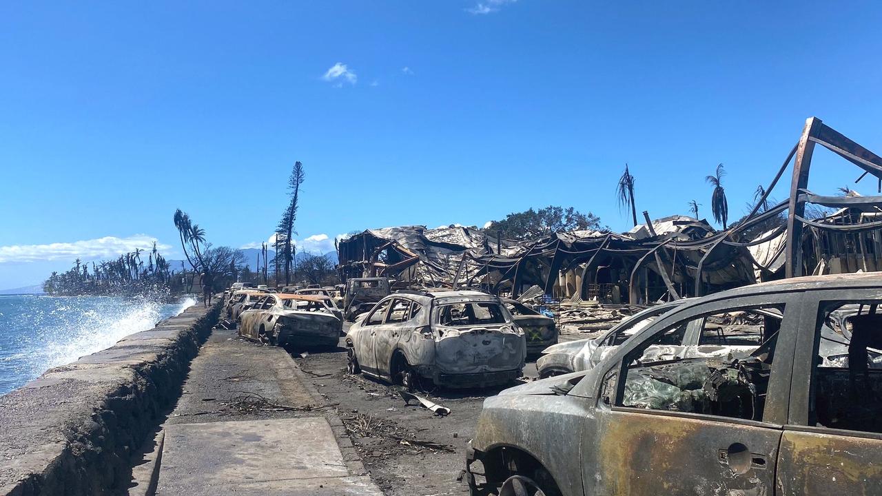 Burned cars and destroyed buildings are pictured in the aftermath the fatal wildfires in the Hawaiian historic tourist town of Lahaina. Picture: Paula Ramon / AFP