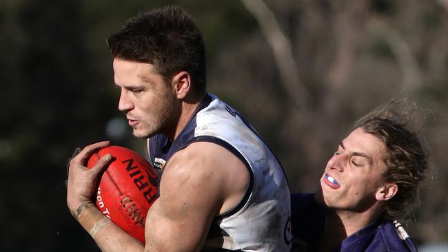 Jason Cooke reels in a mark for Macedon last year. Picture: Mark Dadswell.