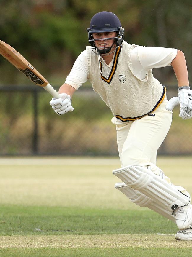 Nick Crawford charges through for a single for Balwyn. Picture: Hamish Blair