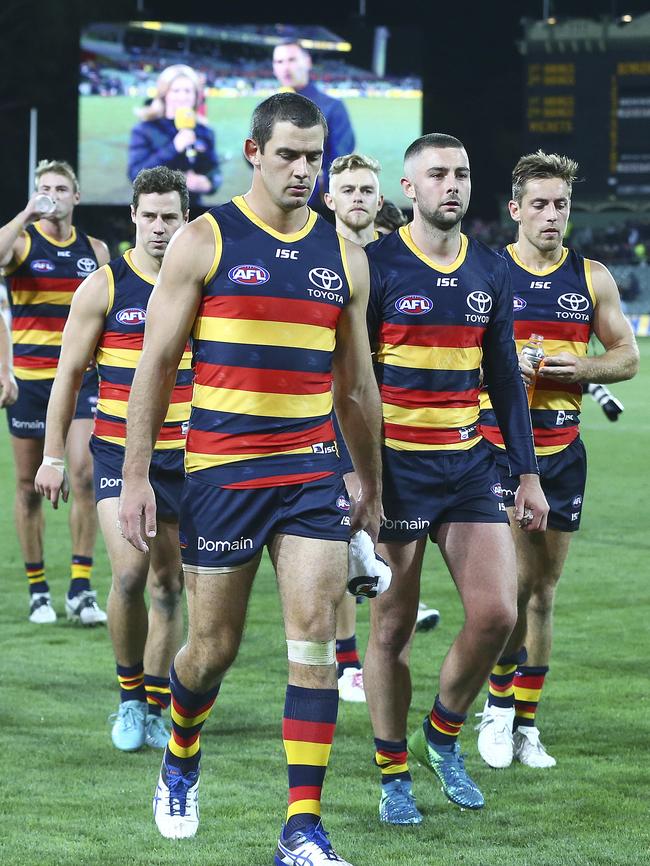 Taylor Walker leads the Crows off Adelaide Oval after their Round 4 loss to Collingwood. Picture Sarah Reed