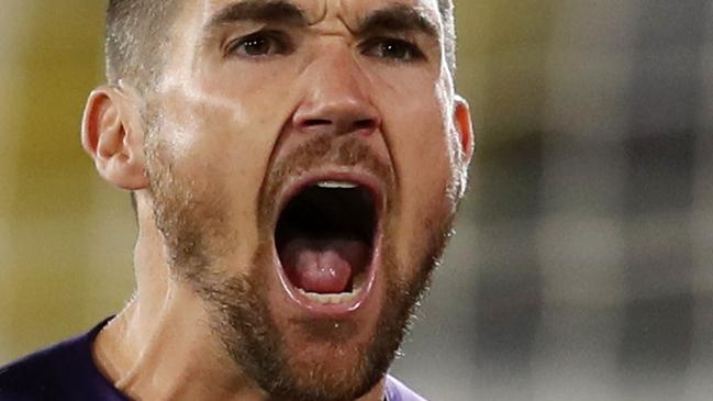 AL AIN, UNITED ARAB EMIRATES - JANUARY 21: Mat Ryan of Australia celebrates after saving the fourth penalty from Marat Bikmaev of Uzbekistan (not pictured) in the penalty shoot out during the AFC Asian Cup round of 16 match between Australia and Uzbekistan at Khalifa Bin Zayed Stadium on January 21, 2019 in Al Ain, United Arab Emirates. (Photo by Francois Nel/Getty Images)