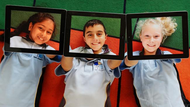 St Monica's Catholic School year 3 students L-R Rishika Bhaskar Rao, Jordan Basha and Jessica Crowle use iPads in class. Story about NAPLAN. Picture: Toby Zerna