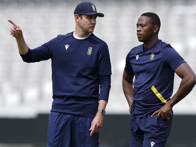 South Africa coach Stuart Broad speaks to Kagiso Rabada, right, during a nets session at Lord's, London, Monday June 9, 2025. (Ben Whitley/PA via AP)