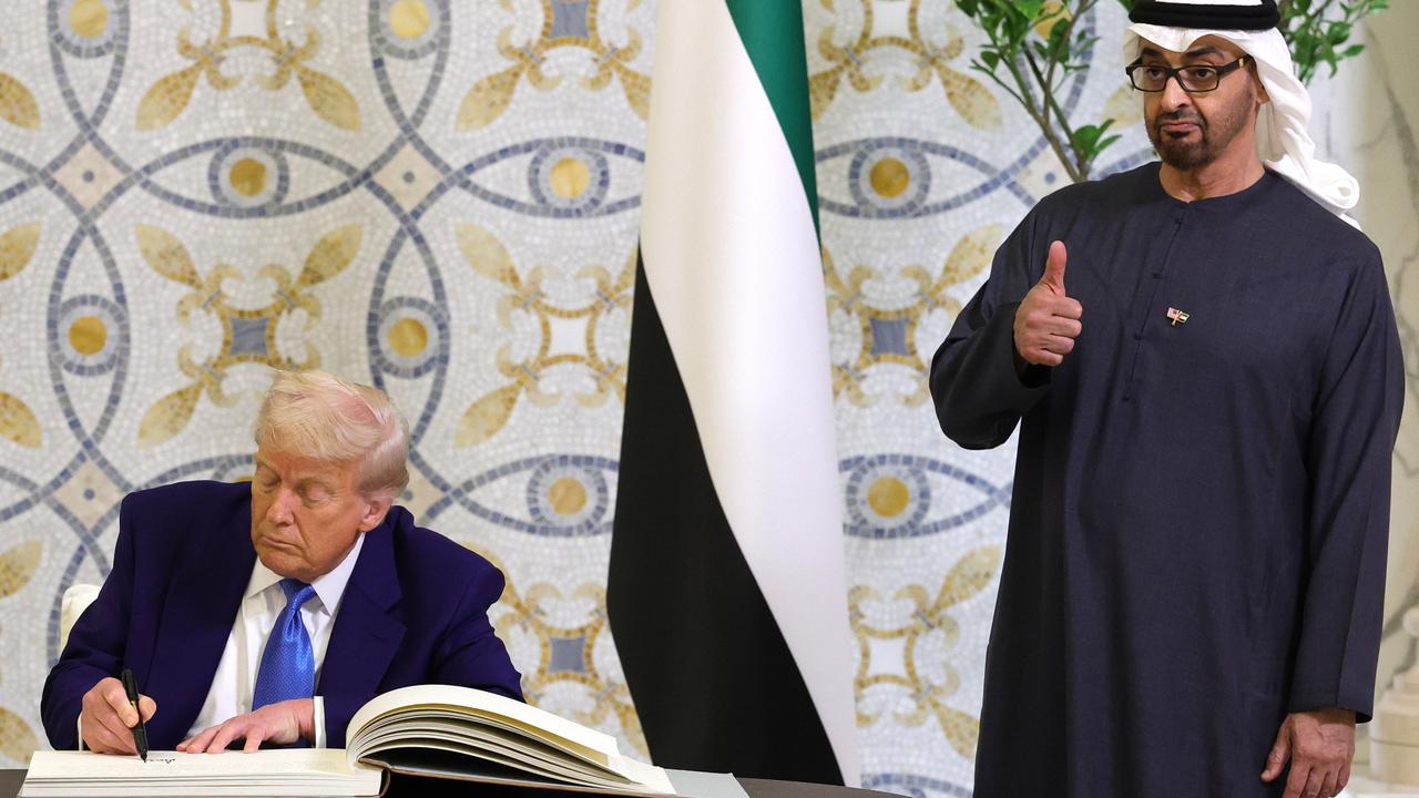 U.S. President Donald J. Trump signs the guestbook as UAE President Sheikh Mohamed bin Zayed Al Nahyan looks on. Picture: Win McNamee/Getty Images)