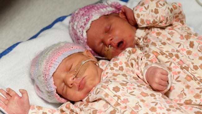 Pre-term identical twins Harper and Ayla Rafter born during the height of the storm last Saturday pictured with mum and dad Chloe and Jordan Rafter and big sister Addalyn. Picture: Shae Beplate.