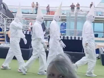 P&O Cruises Australia has issued an apology after passengers were left in shock when staff came out seemingly dressed up as white supremacist Ku Klux Klan members during a Christmas-themed event.