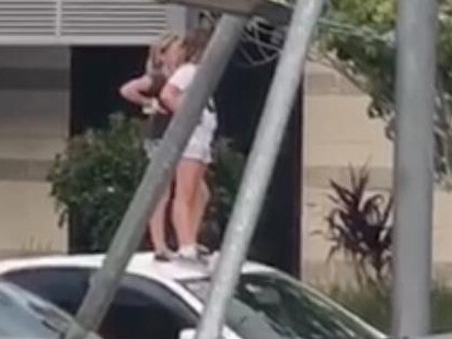 The two children on top of the car. Picture: supplied