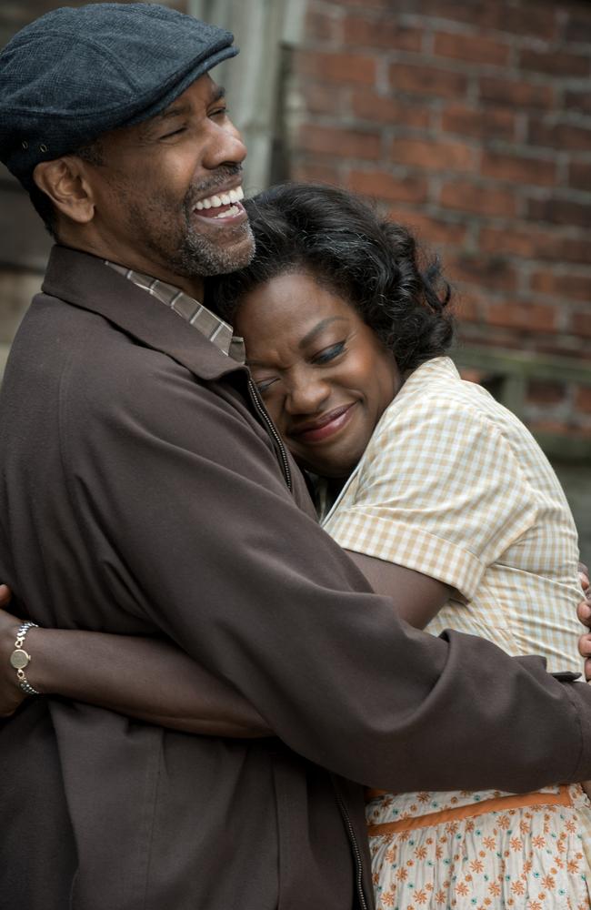 Denzel Washington plays Troy Maxson hug Viola Davis, who plays his wife Rose, in a scene from Fences. Picture: David Lee / Paramount Pictures