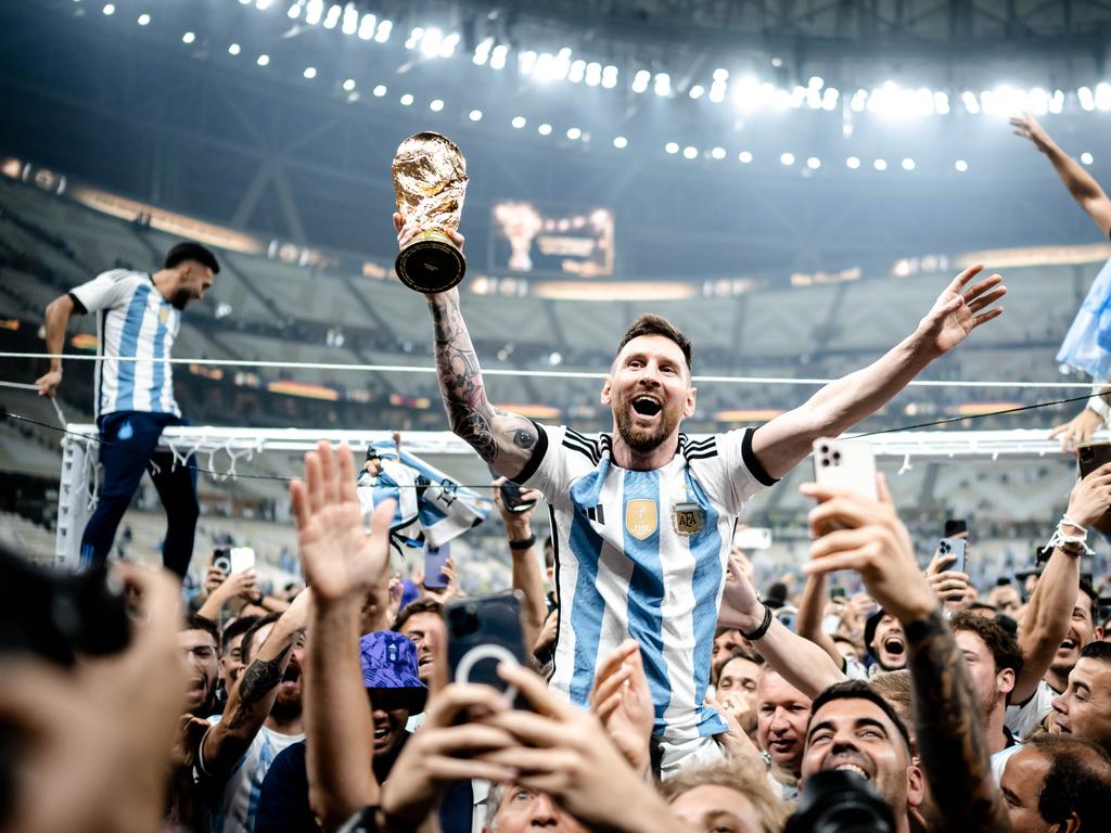 Lionel Messi celebrates victory with the World Cup trophy last year's tournament. Picture: Getty