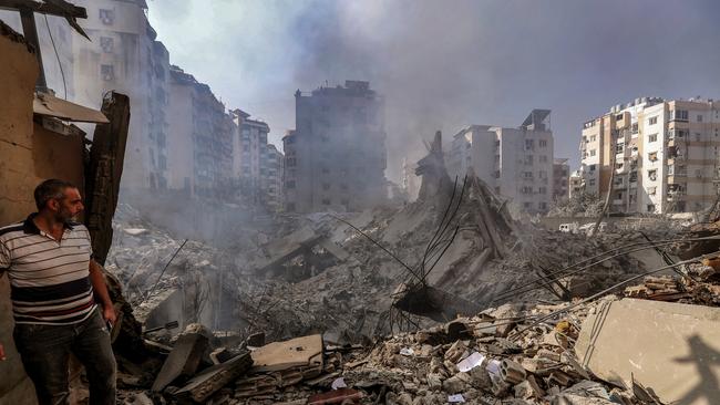 A man inspects damages after Israeli air raids at a street in Beirut. Picture: Getty Images