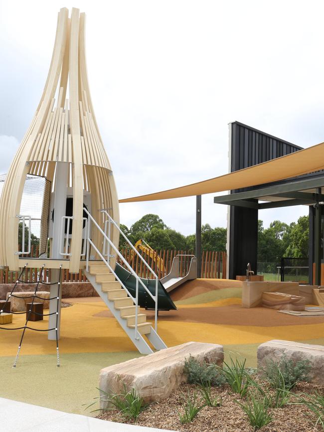 An outdoor dining area incorporates a children’s play area and deck. Picture: Robert Pozo