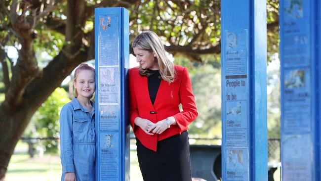 Malia Knox, 8, with Minister for Women Shannon Fentiman