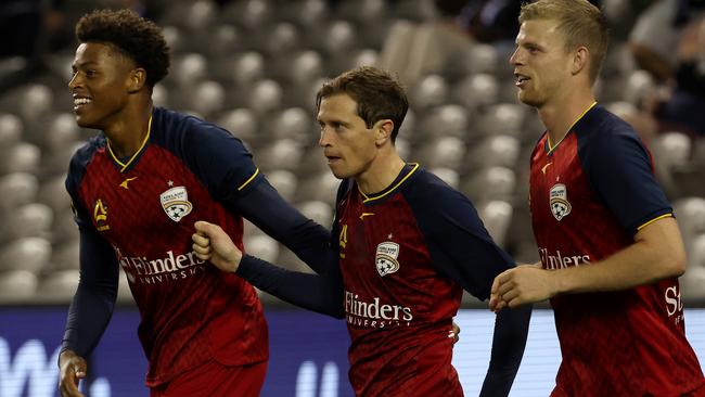 Kusini Yengi, left, of Adelaide United celebrates his goal during the round-12 A-League match between Melbourne Victory and his team at Marvel Stadium on Saturday. Picture: Jonathan DiMaggio/Getty Images
