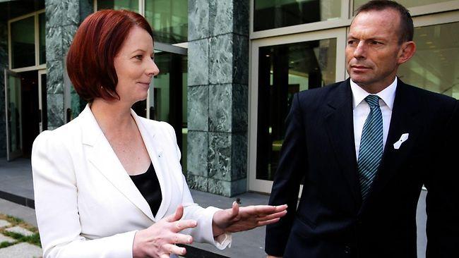 In a rare moment of bipartisan togetherness, Julia Gillard and Tony Abbott attend the White Ribbon Day launch in Canberra yesterday. Picture: Kym Smith