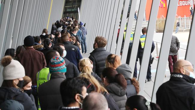 Some people desperate for a jab chose to wait in queue outside the Melbourne Convention and Exhibition Centre. Picture: David Crosling